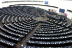 An almost empty European Parliament listens to Belgium's Louis Michel, the European Commissioner for Development and Humanitarian Aid, Tuesday April 22, 2008 in Strasbourg, eastern France. The debate focused on unrest caused by rising food prices. (AP Photo/Cedric Joubert)